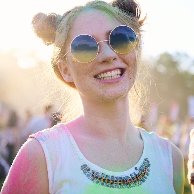 Portrait of colorful woman during music festival Portrait of colorful woman during music festival